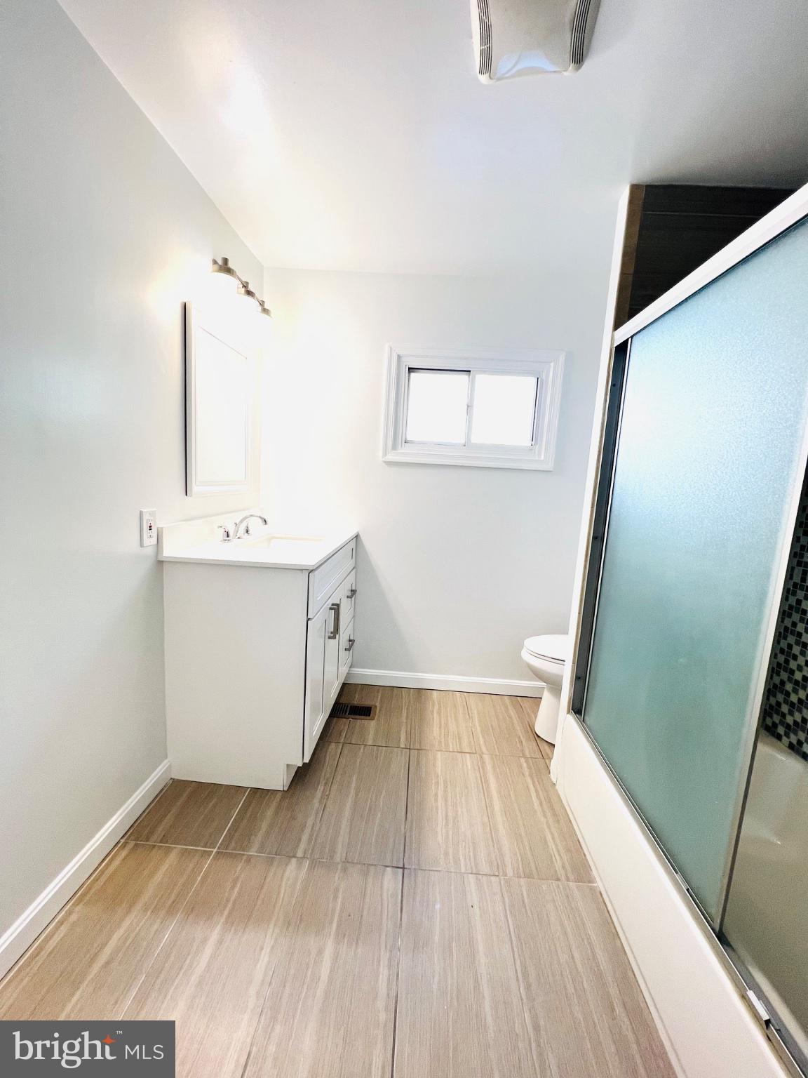 5709 Dade Street Capitol Heights, MD 20743 - Photo 19 of 30 a view of a kitchen with wooden floor and electronic appliances