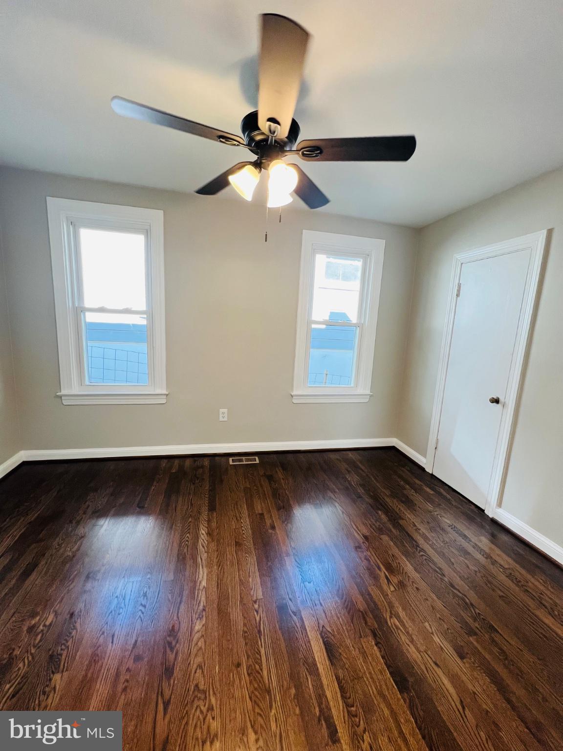 5709 Dade Street Capitol Heights, MD 20743 - Photo 25 of 30 a view of an empty room with wooden floor and a window