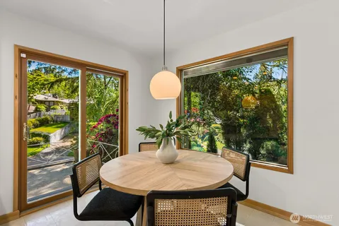 a kitchen with stainless steel appliances granite countertop sink stove and large window