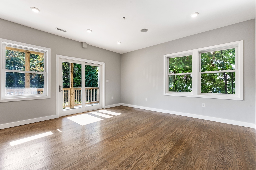 10 Ruthven Park, Unit 2 Boston, MA 02121 - Photo 14 of 25 a view of an empty room with wooden floor and a window