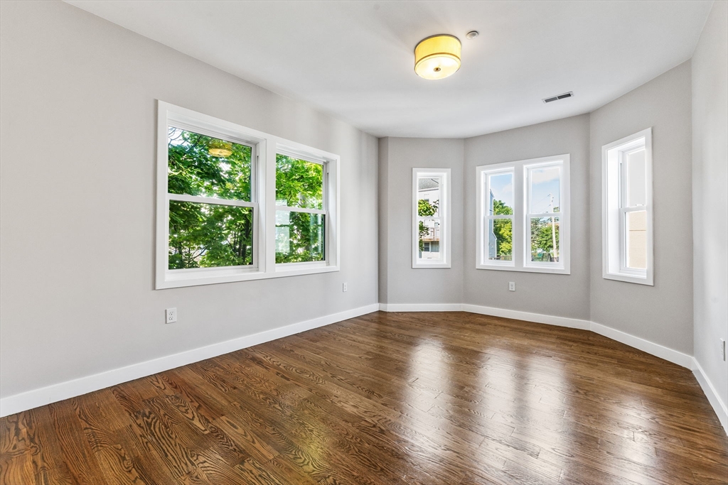 10 Ruthven Park, Unit 2 Boston, MA 02121 - Photo 15 of 25 a view of room with window and wooden floor