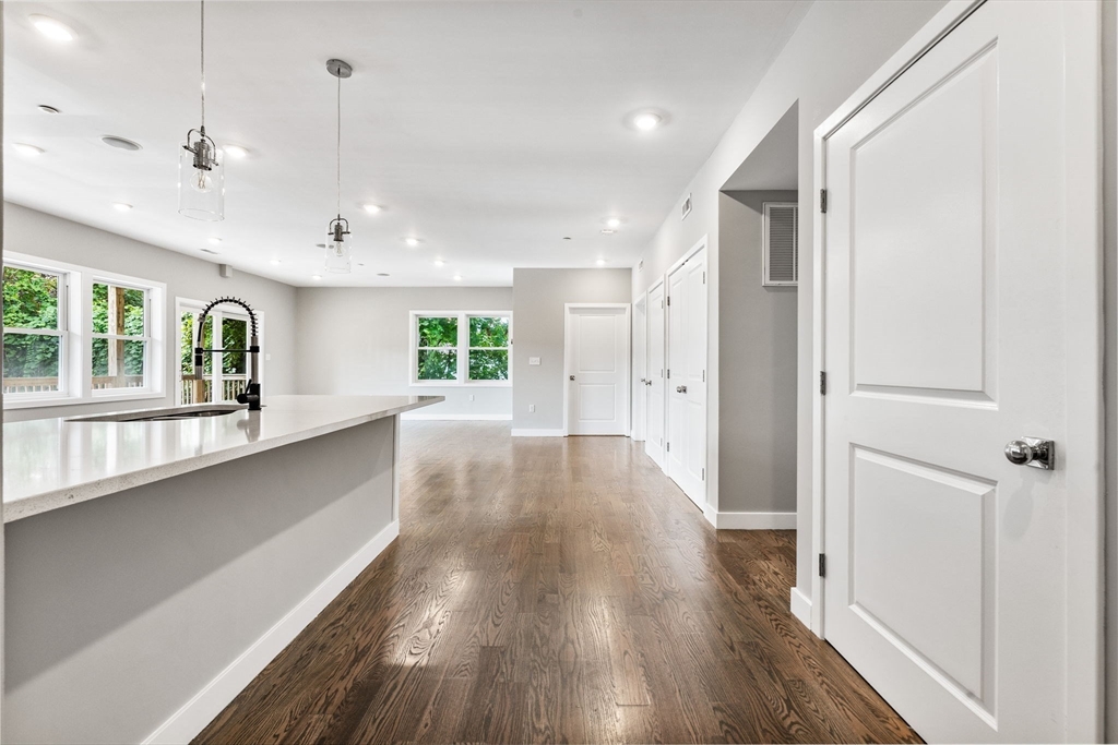 10 Ruthven Park, Unit 2 Boston, MA 02121 - Photo 3 of 25 a view of a hallway with wooden floor and staircase