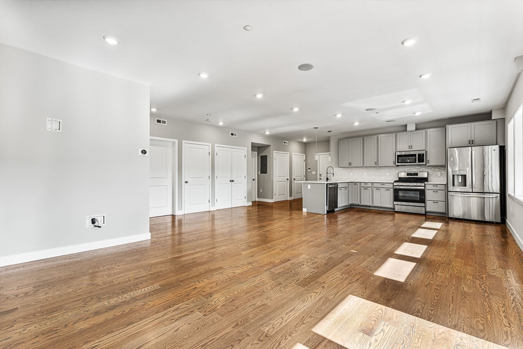 10 Ruthven Park, Unit 2 Boston, MA 02121 - Photo 9 of 25 a view of kitchen with wooden floor