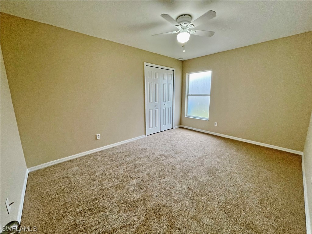 2804 Nelson Road North Cape Coral, FL 33993 - Photo 13 of 16 a view of an empty room with a window