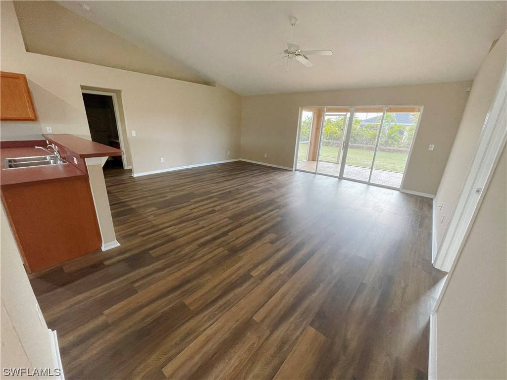 2804 Nelson Road North Cape Coral, FL 33993 - Photo 2 of 16 a view of livingroom with hardwood floor and hallway