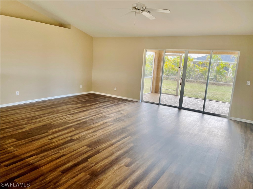 2804 Nelson Road North Cape Coral, FL 33993 - Photo 3 of 16 wooden floor in an empty room with a window