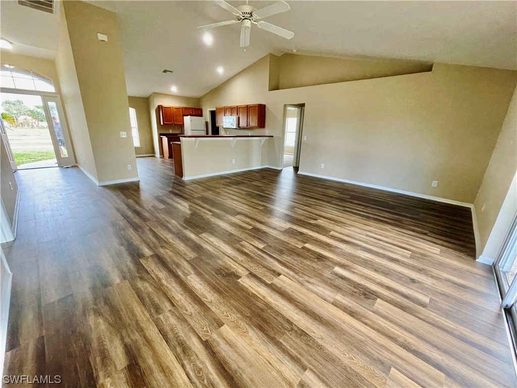 2804 Nelson Road North Cape Coral, FL 33993 - Photo 4 of 16 a view of a room with wooden floor
