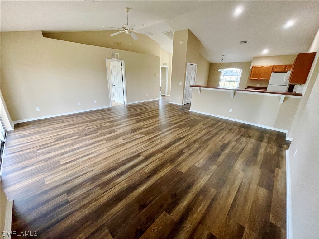 2804 Nelson Road North Cape Coral, FL 33993 - Photo 5 of 16 a view of a room with wooden floor
