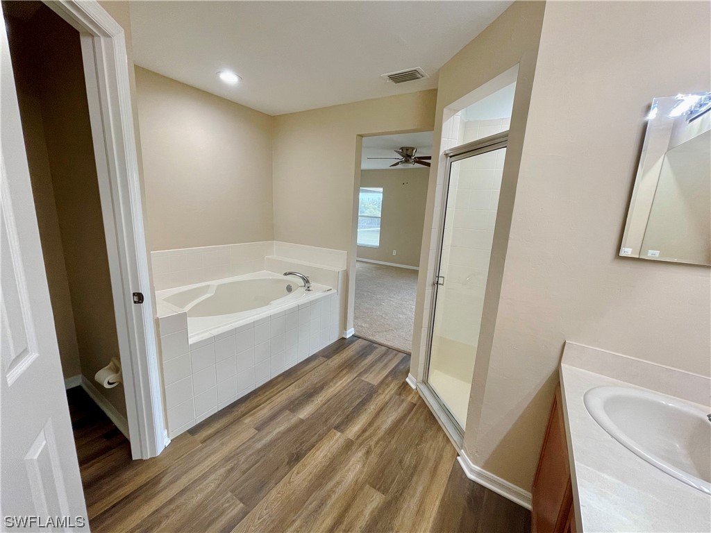 2804 Nelson Road North Cape Coral, FL 33993 - Photo 10 of 16 a bathroom with a bathtub and a shower