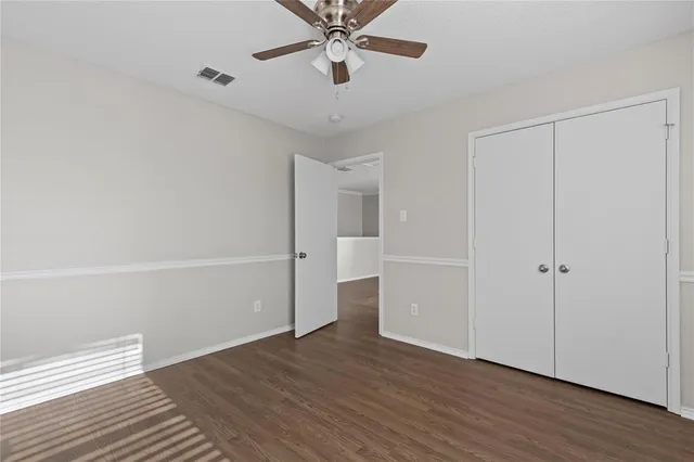 a bathroom with a sink toilet vanity and shower