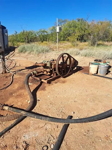 a view of a swimming pool with a yard