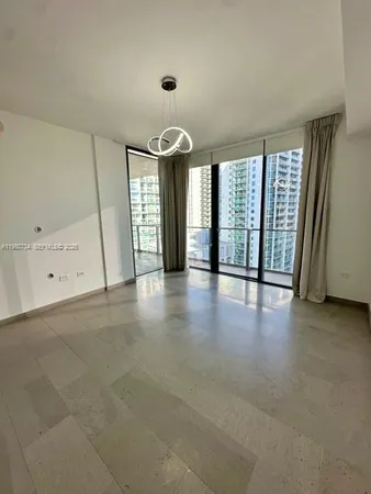 an empty room with a fireplace