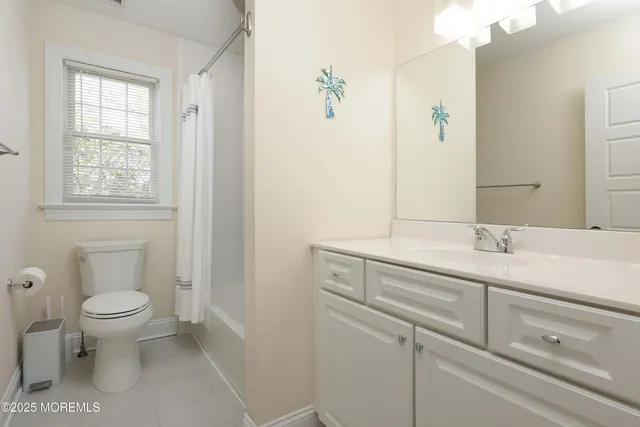 a bathroom with a sink toilet and vanity