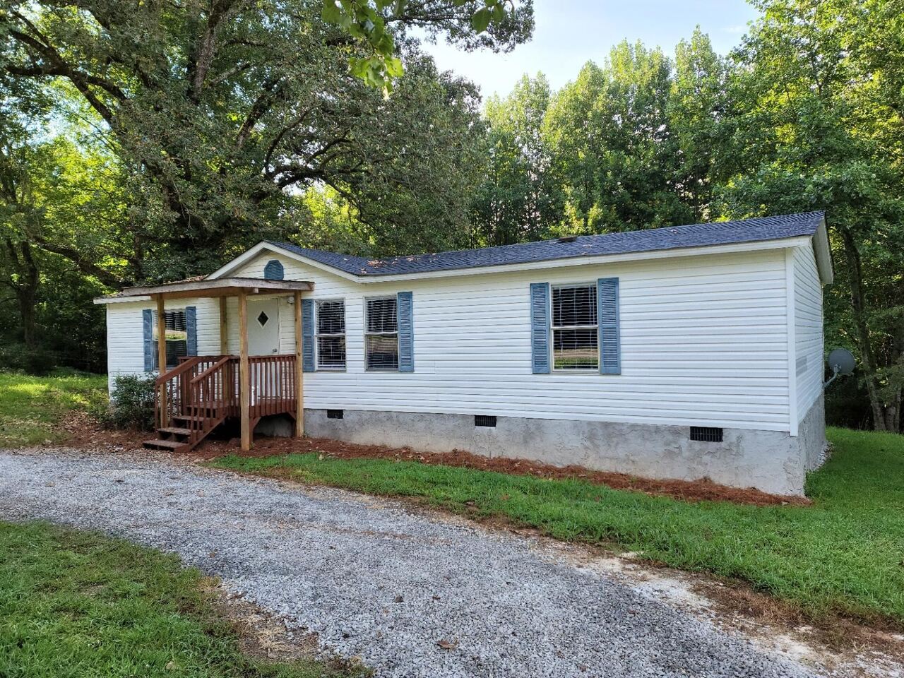674 Hank Fry Road Clarkesville, GA 30523 - Photo 1 of 1 a view of a house with a yard and lawn chairs
