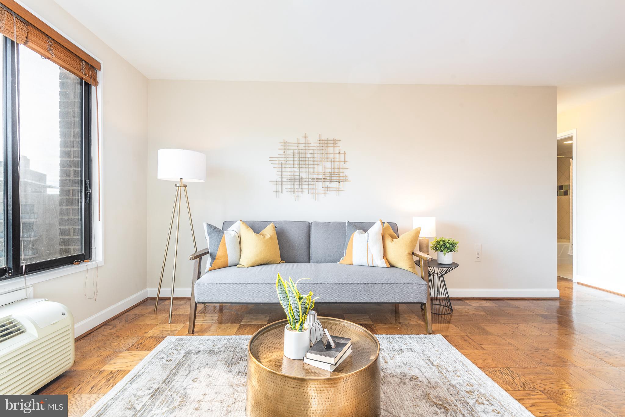 2501 Calvert Street Northwest, Unit 811 Washington, DC 20008 - Photo 2 of 28 a living room with furniture and a table
