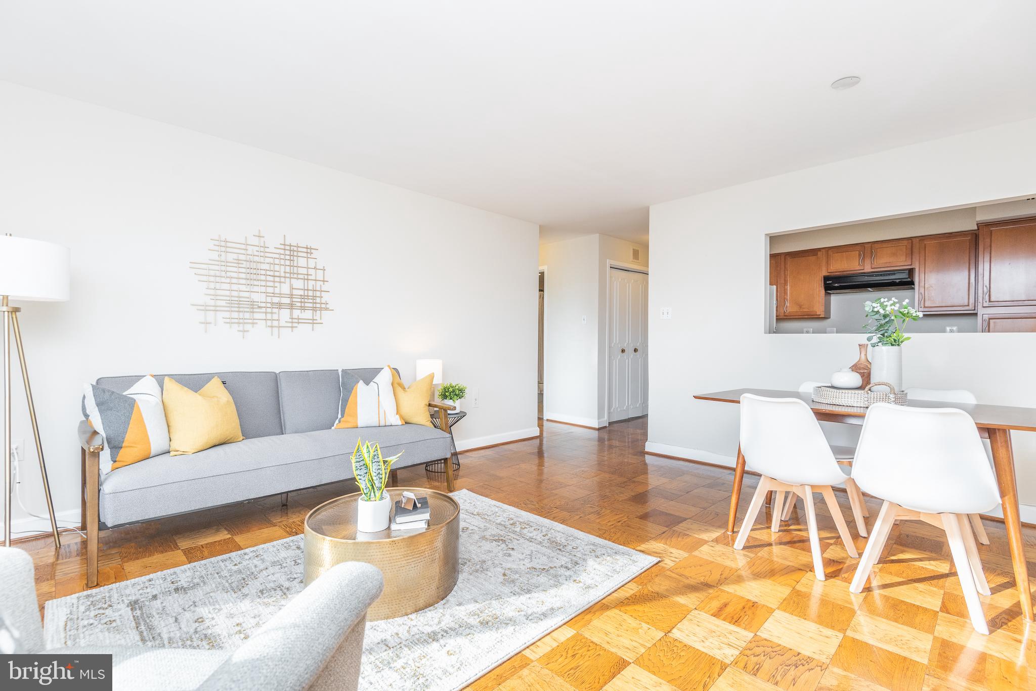 2501 Calvert Street Northwest, Unit 811 Washington, DC 20008 - Photo 3 of 28 a living room with furniture and a table