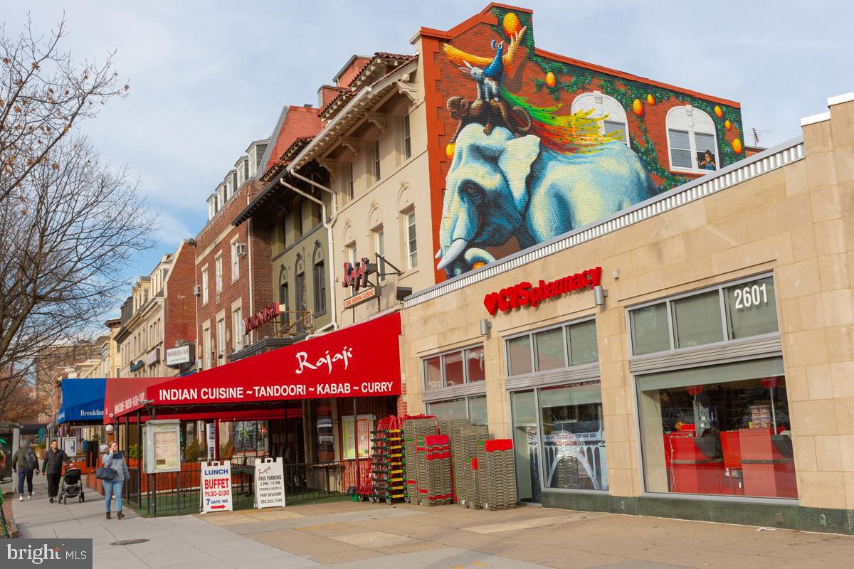2501 Calvert Street Northwest, Unit 811 Washington, DC 20008 - Photo 22 of 28 a view of a building with a lot of people on a street