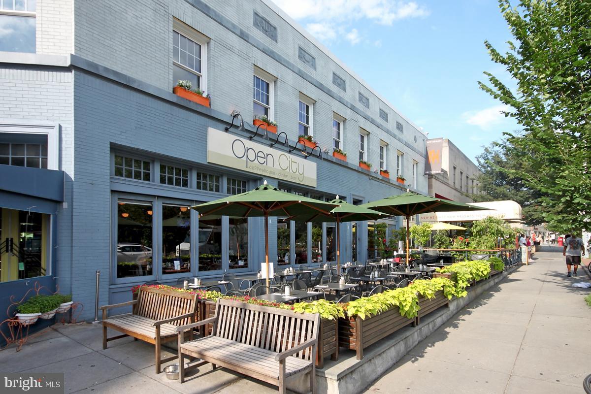 2501 Calvert Street Northwest, Unit 811 Washington, DC 20008 - Photo 24 of 28 a view of a cafe with sitting area