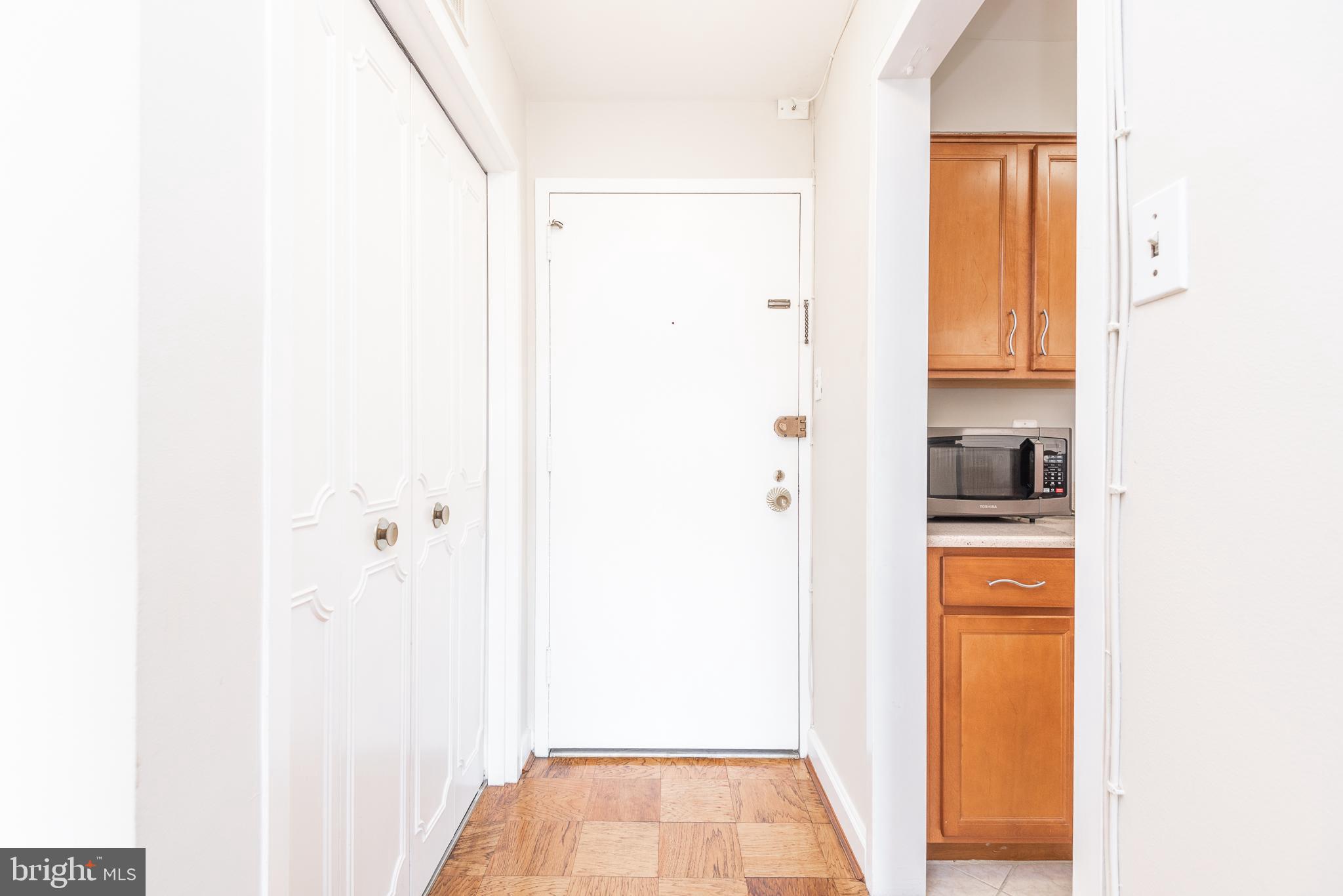 2501 Calvert Street Northwest, Unit 811 Washington, DC 20008 - Photo 6 of 28 a view of walk in closet with rug
