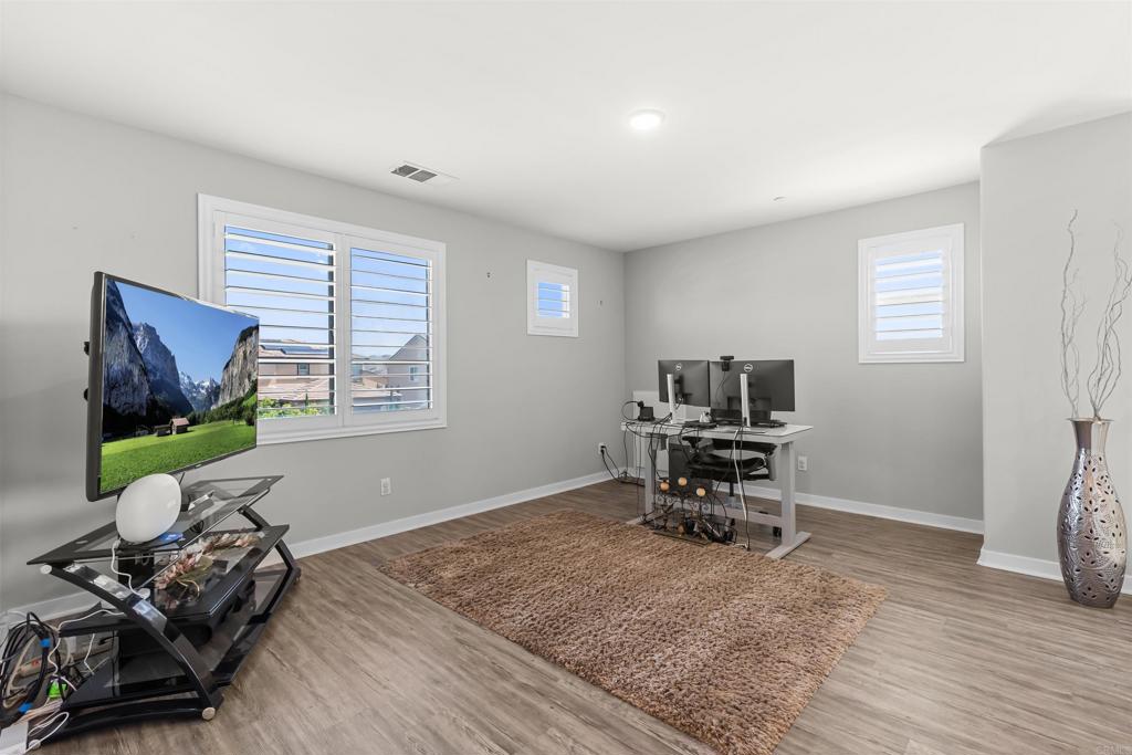 29809 Gypsy Vanner Way Menifee, CA 92584 - Photo 23 of 45 a room with furniture and a window