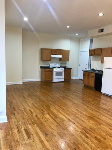 6263 North Clark Street, Unit 2 Chicago, IL 60660 - Photo 3 of 14 a kitchen with stainless steel appliances a refrigerator and a stove top oven