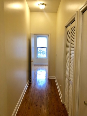 6263 North Clark Street, Unit 2 Chicago, IL 60660 - Photo 7 of 14 a view of a room with wooden floor and a window