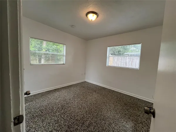 an empty room with windows