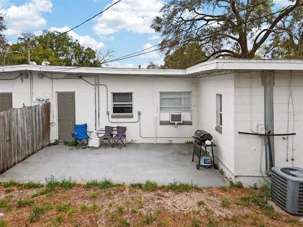 a backyard of a house with seating space