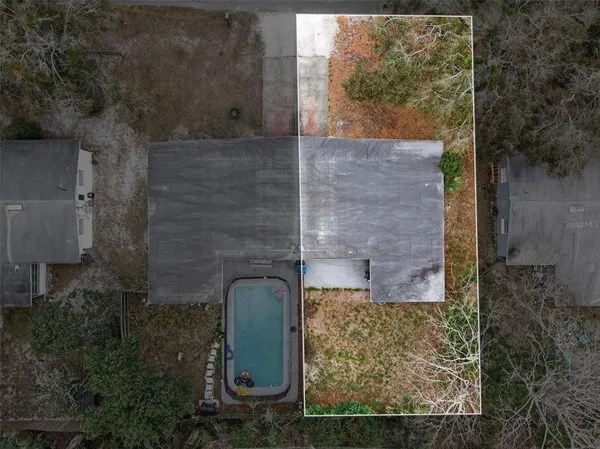 front view of a brick house with a yard