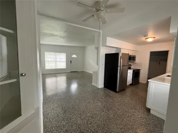 a view of an empty room with a window