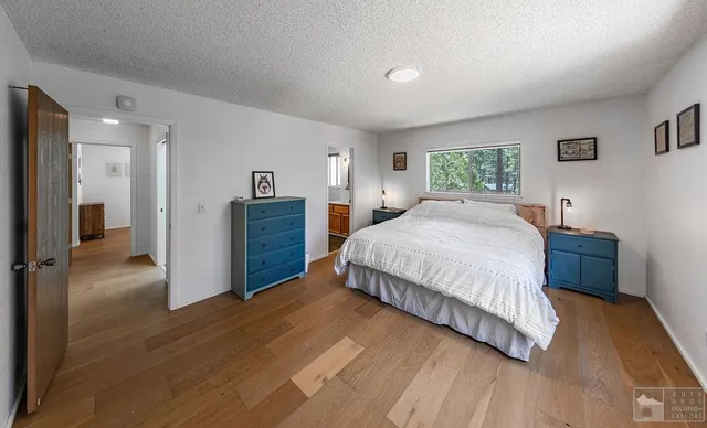 a bedroom with a bed and a view