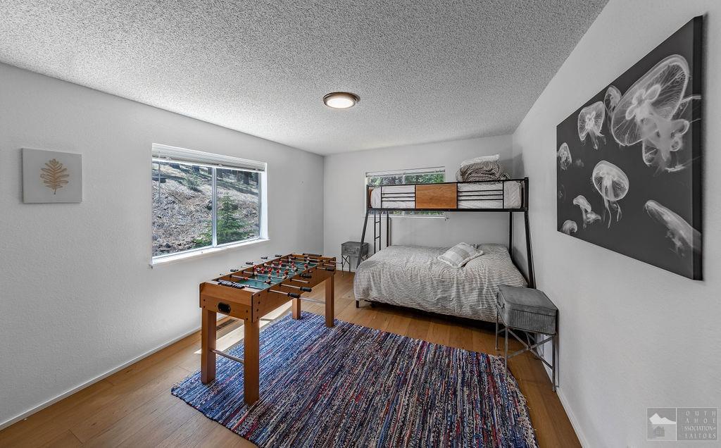 270 Timber Lane Markleeville, CA 96120 - Photo 9 of 24 a bedroom with furniture and a wooden floor