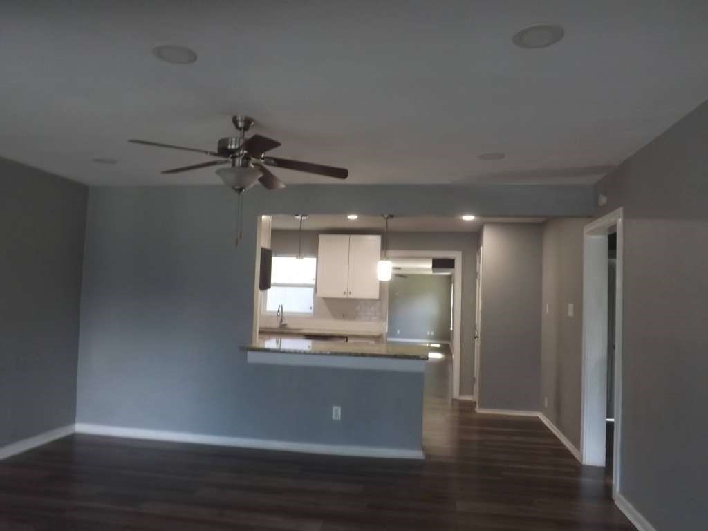 7619 Ilex Street Houston, TX 77012 - Photo 6 of 15 a view of a kitchen counter space and wooden floor