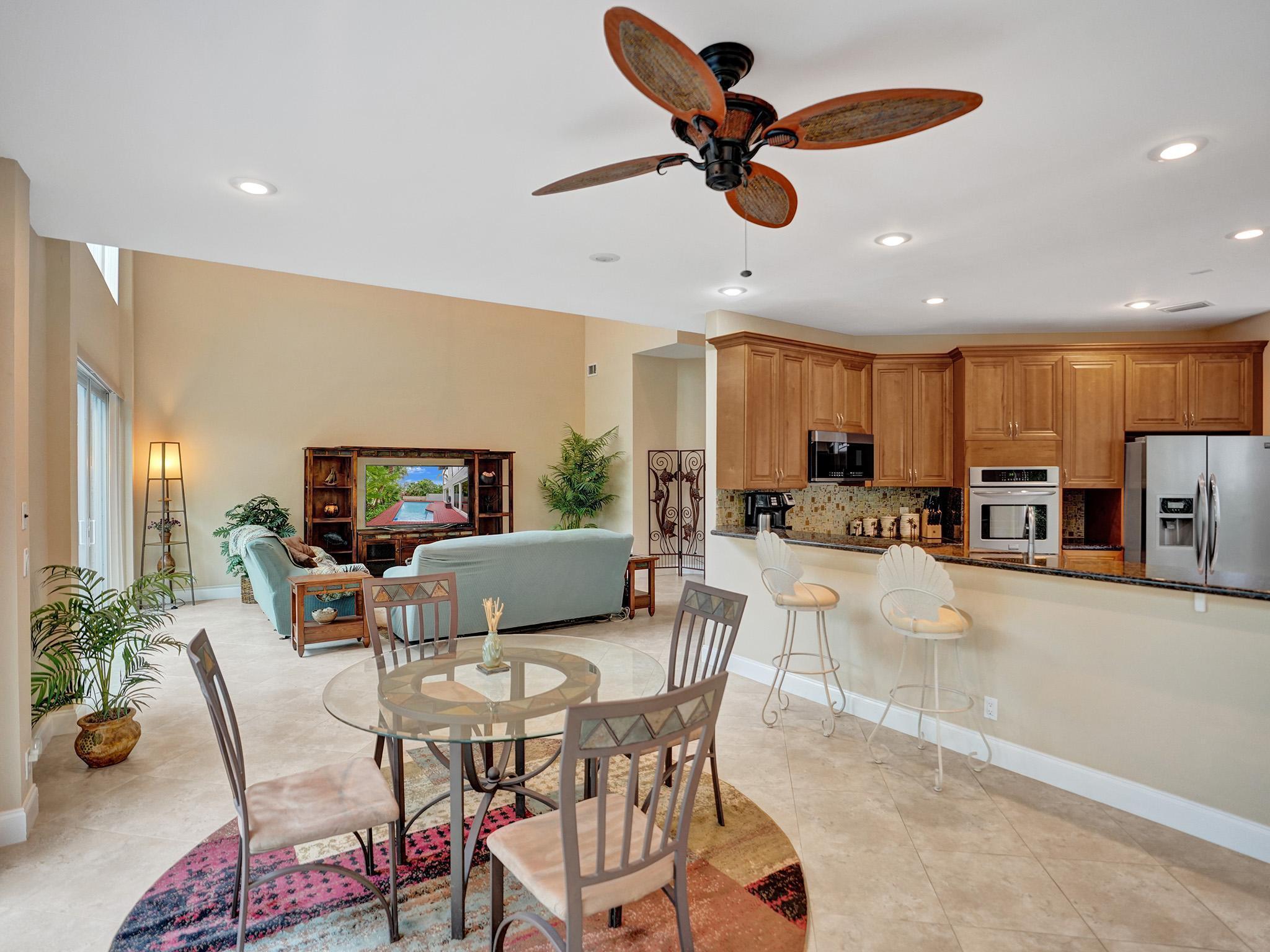 17288 Hampton Boulevard Boca Raton, FL 33496 - Photo 12 of 36 a living room with furniture and a flat screen tv