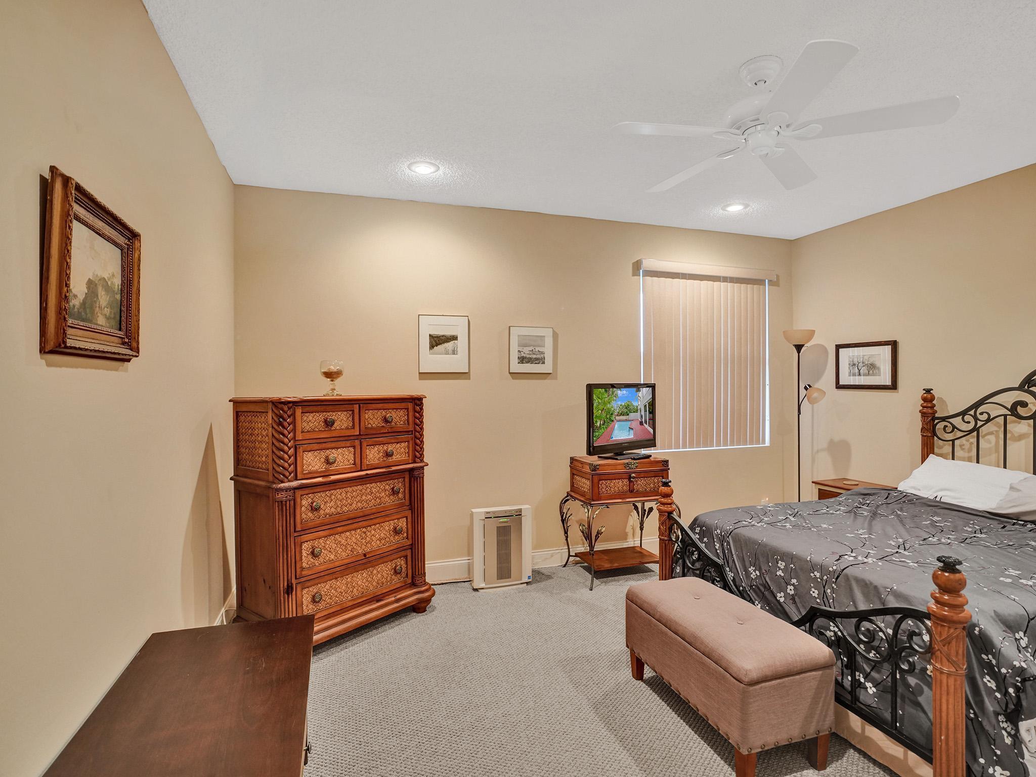 17288 Hampton Boulevard Boca Raton, FL 33496 - Photo 15 of 36 a bedroom with furniture and a couch