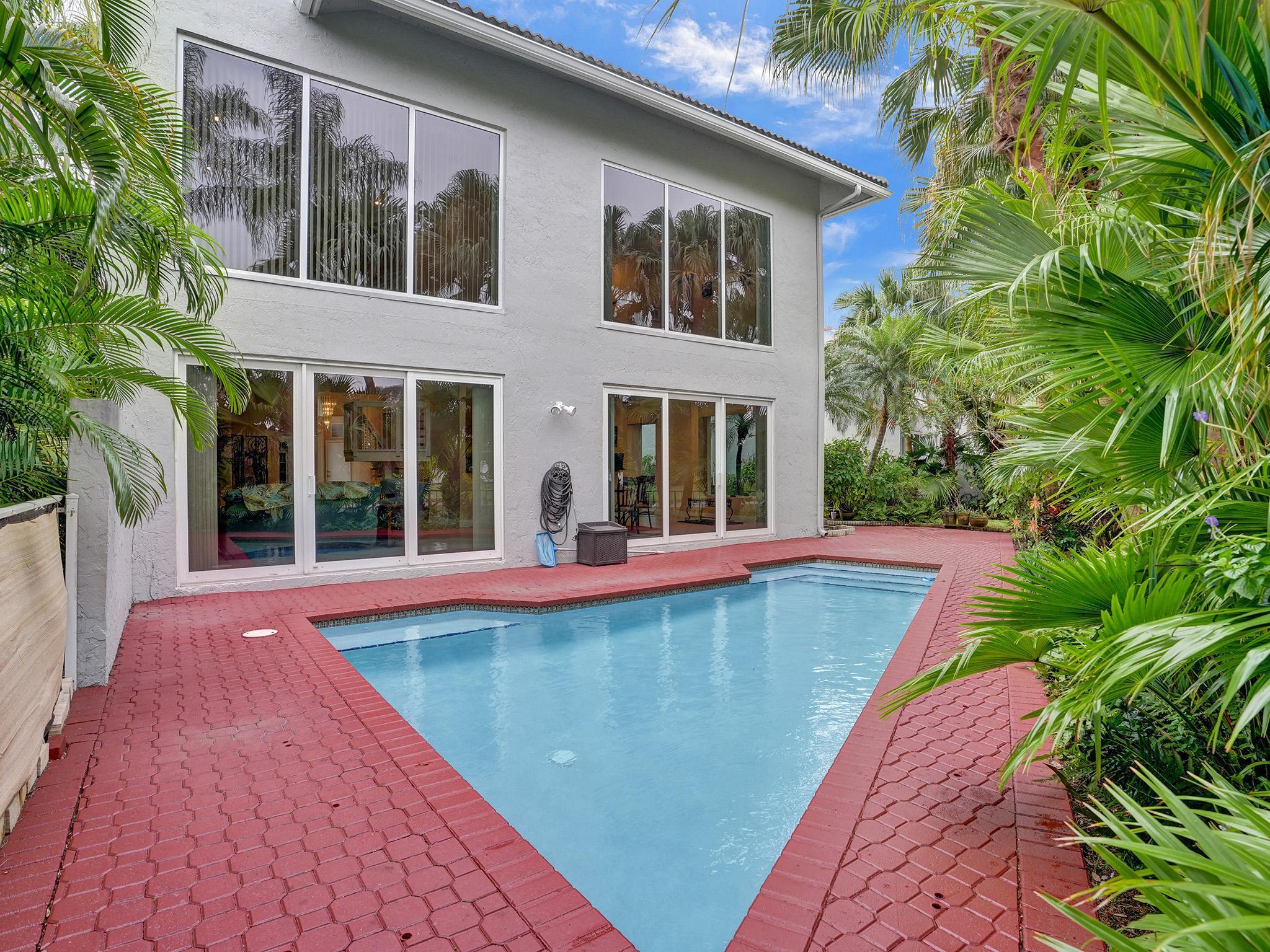 17288 Hampton Boulevard Boca Raton, FL 33496 - Photo 2 of 36 a view of swimming pool with a lounge chairs