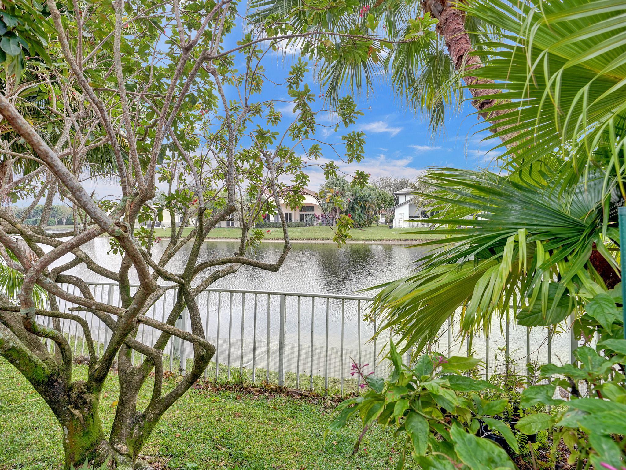 17288 Hampton Boulevard Boca Raton, FL 33496 - Photo 21 of 36 a view of swimming pool from a lake