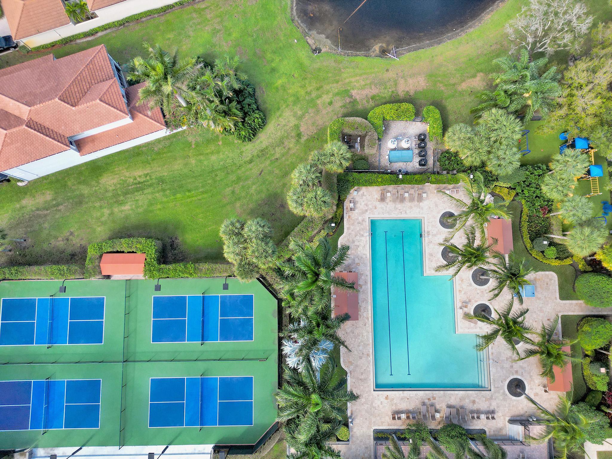 17288 Hampton Boulevard Boca Raton, FL 33496 - Photo 26 of 36 a plant that is sitting in front of a building