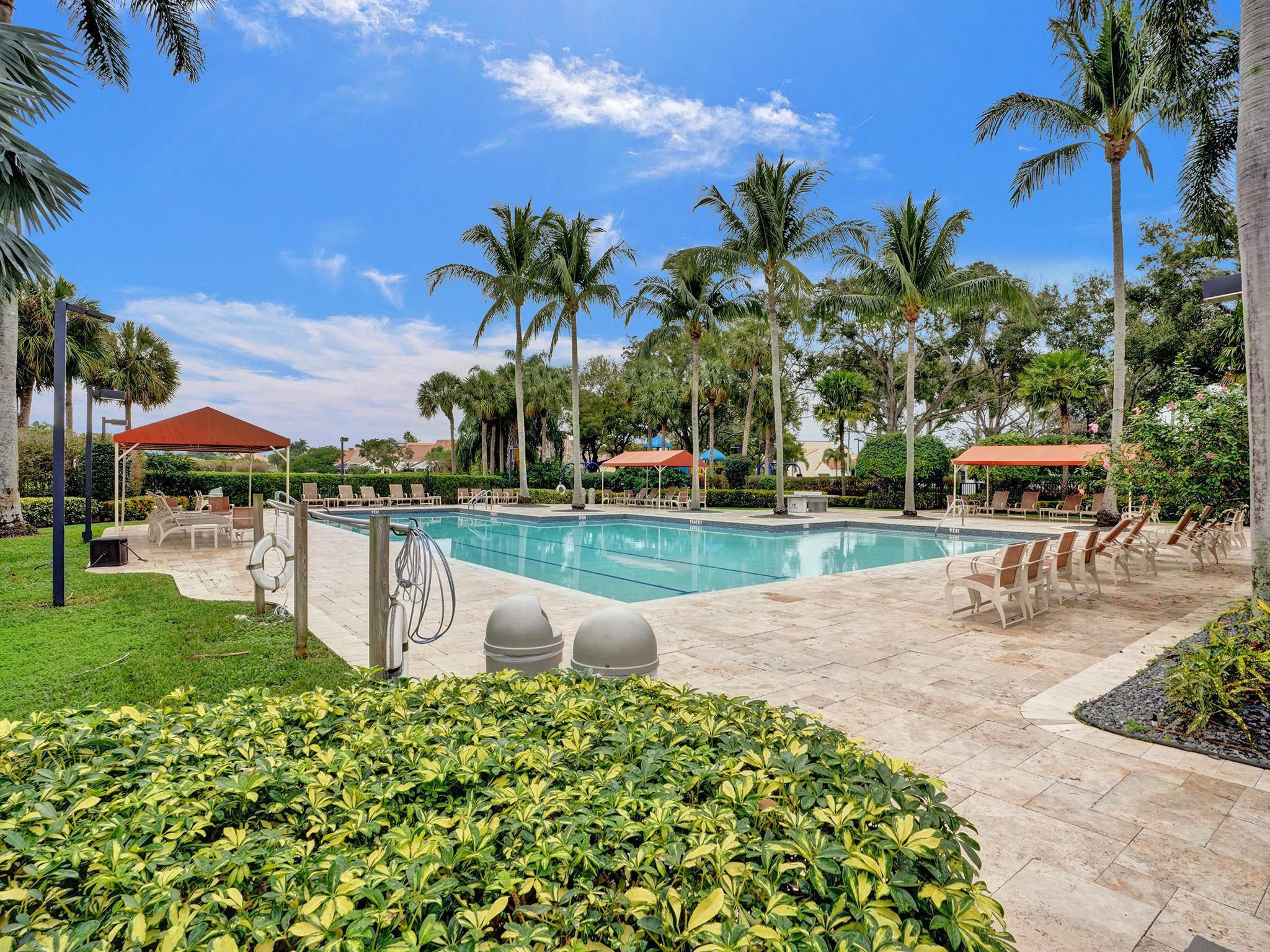 17288 Hampton Boulevard Boca Raton, FL 33496 - Photo 27 of 36 a view of a garden with a lake