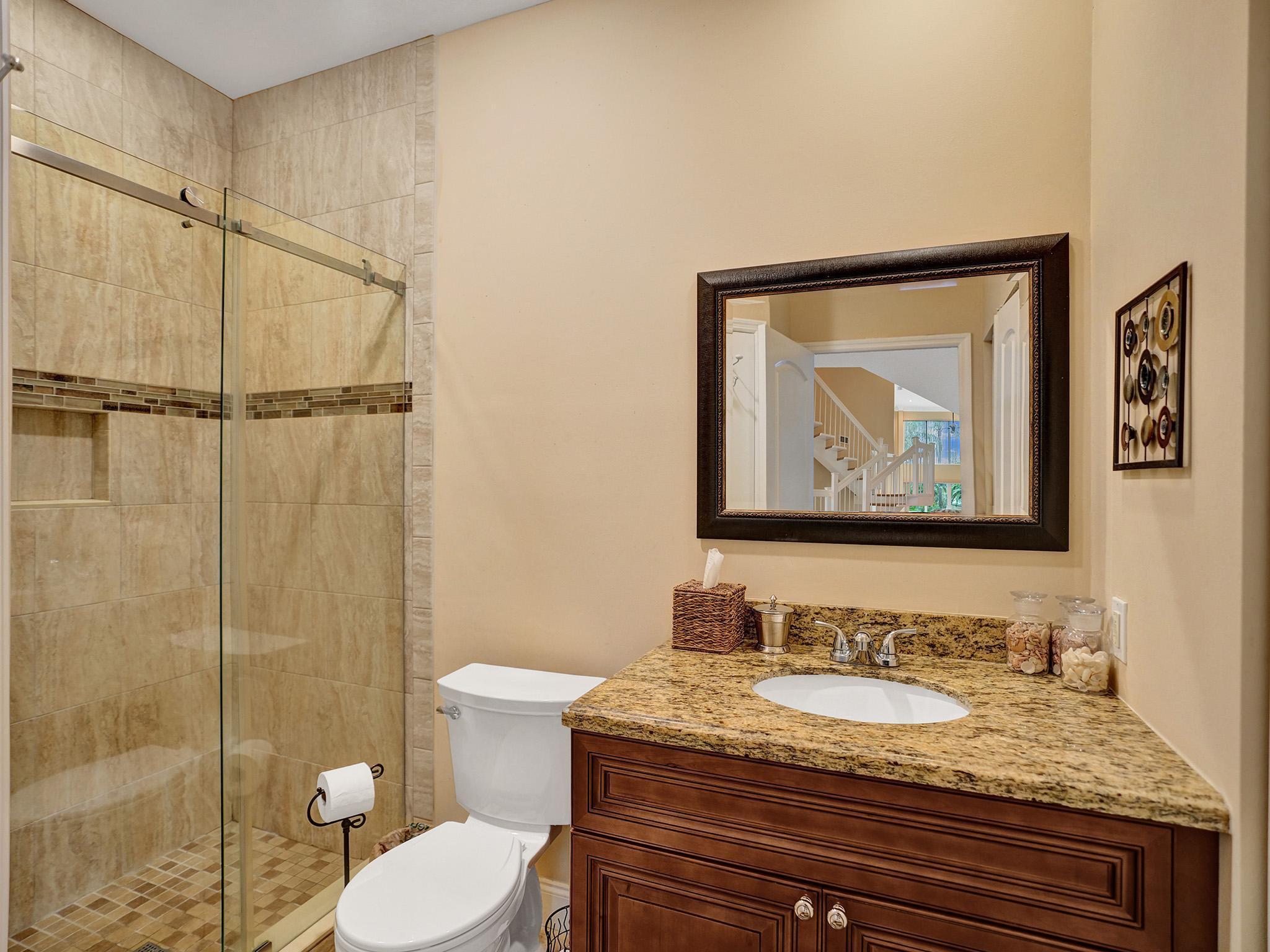 17288 Hampton Boulevard Boca Raton, FL 33496 - Photo 9 of 36 a bathroom with a granite countertop sink toilet and shower