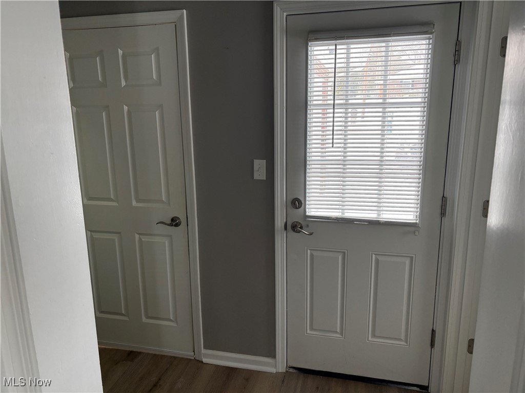 7817 Dalebrook Road Independence, OH 44131 - Photo 11 of 28 Doorway to outside featuring dark hardwood / wood-style floors