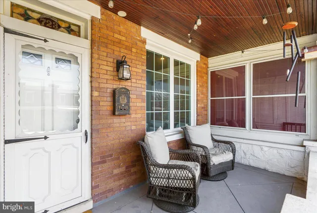 a balcony with furniture and window