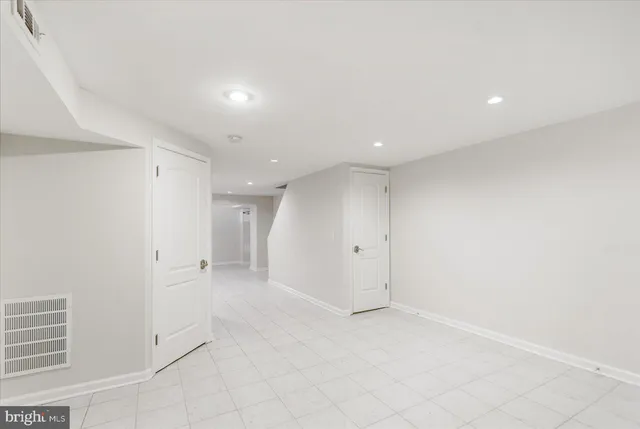 a bathroom with a shower and a glass door