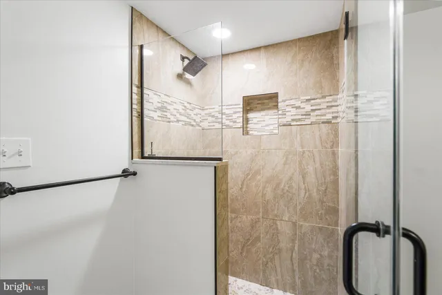 a bathroom with a sink vanity and a mirror