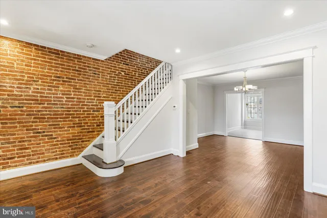 a view of an entryway with wooden floor