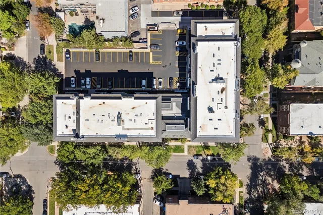 a view of a street with tall buildings