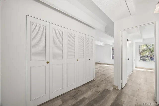 a view of a bathroom with wooden floor