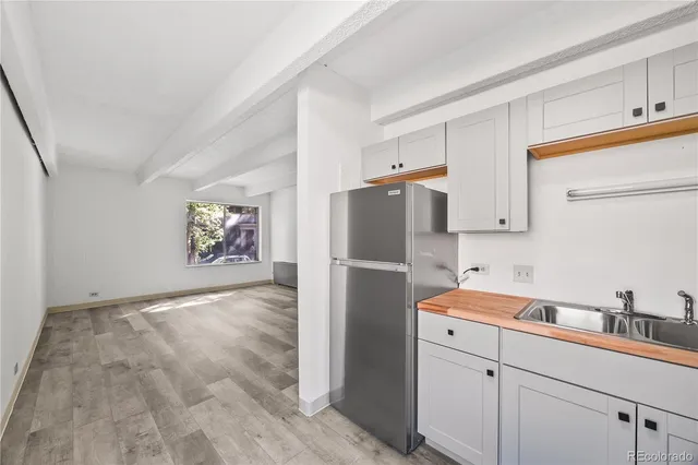 a utility room with cabinets washer and dryer