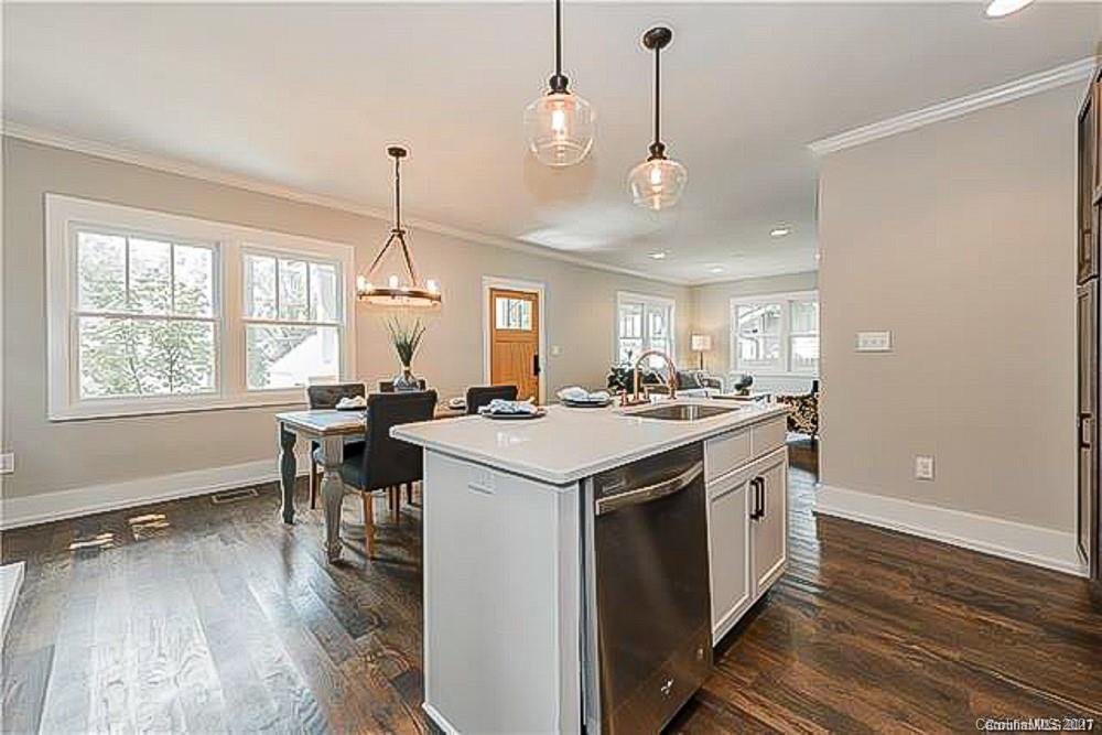 2116 Rozzelles Ferry Road Charlotte, NC 28208 - Photo 12 of 24 a kitchen with a stove and a wooden floors