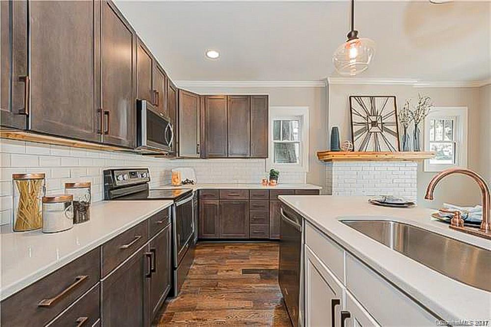2116 Rozzelles Ferry Road Charlotte, NC 28208 - Photo 13 of 24 a kitchen with a sink stove and microwave